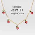 Detailed view of cherry pendant necklace with red cubic zirconia on gold chain - Gold Heart Red Necklace