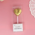 Golden heart-shaped birthday candle on white stand in elegant transparent packaging - Gold Diamond Heart Candle
