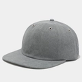 Detailed close-up of grey twill baseball cap with silver metal eyelets and fine stitching - Adjustable / Gray