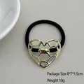 Elastic hair tie with gold heart-shaped honeycomb metal charm in geometric style - Hollow Hexagon Heart