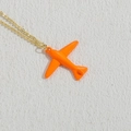 Golden chain necklace featuring a vibrant orange airplane pendant on white background - Orange (XL2377)
