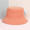 Solid coral pink cotton bucket hat with durable stitching and minimalist sun protection style - Orange