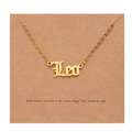 Detailed close-up of 18k gold plated Leo zodiac necklace pendant on a kraft paper card - Gold-Leo