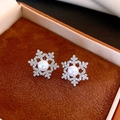 Detailed view of snowflake earrings with 18k gold plating, pearls and zircon on brown velvet - 37# Pearl Snowflake Silver (37# Silver Pin-Silver-White)