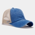 Detail of denim blue trucker hat with beige mesh back and curved brim for breathability - Adjustable / Blue