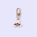 Cute golden keychain featuring a white bear holding a rainbow charm on a purple background - Rainbow Rabbit