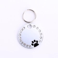 Silberner runder Hundemarke aus Edelstahl mit Strasssteinen und schwarzem Pfotenabdruck - 25mm / Schwarz