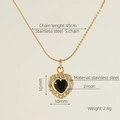 Detail der 45cm Edelstahl S-Kette mit 10mm schwarzem Zirkon Herzanhänger im Fokus - 18K Gold / Schwarz