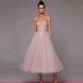 Elegant strapless tulle corset midi dress in soft pink with voluminous A-line skirt - US size 2 (S) / Pink