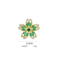 Detail of flower brooch featuring a green gemstone center and white crystal border - B802 Green/Five-Petal Flower