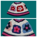 Handmade crochet floral bucket hat in white with colorful granny square patterns - One Size / Small Sunflower Hat