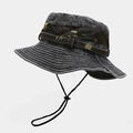 Detail view of outdoor camo bucket hat with metal eyelets and adjustable windproof rope - One Size / Black