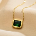 Close-up of emerald green square zircon pendant on a gold stainless steel chain - Green