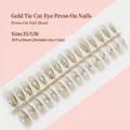 Golden cat eye press-on nails in trapezoid shape with elegant V-shaped tie design detail - Gold Tie Cat-Eye Style (MY266-T) / 30 Pcs/Strip