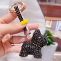 Portachiavi Bulldog francese in cristallo nero con borchie dorate e cinturino coordinato - Nero