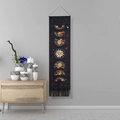 Bohemian moon phase tapestry with floral designs and black tassels on a grey wall - Moon Phase Floral - Black