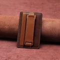 Two-tone brown leather phone card holder with sliding hand strap and stand function - Brown