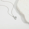 Minimalist silver initial P pendant necklace with honeycomb texture on white rock - Letter P / Silver