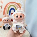 Plush doll wearing a white summer knit hat and cotton overalls with radio embroidery - Radio Overalls Set / First And Second Generation Keychains Are Compatible With La Cloth Dolls. Dolls Not Included.