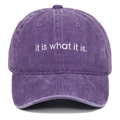 Close-up of white 'it is what it is' embroidery on purple washed cotton baseball cap - Adjustable / Purple