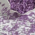 DIY purple 2x7mm silver-lined glass bugle beads spilling from a white petal-shaped bowl - Diameter approx 2mm x Length approx 7mm 15g/Pack Approx 300 Pieces / Violet