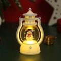 Close-up of white LED Christmas lantern with snowman print and warm glowing light - White Snowman
