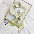 Pale green Twilly silk scarf with yellow daisy floral print draped over a gold frame - 7*100cm / Yellow Pink Star