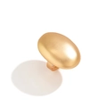Macro shot of large oval matte gold ring featuring a modern smooth pebble design - Gold Oval