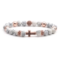 Macro shot of white turquoise beads and rose gold cross pendant with black zircon inlays - White Turquoise Cross