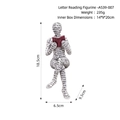 Nordic abstract figurine reading a red book with black alphabet patterns on white resin - Letter Reading Ornament HC2210