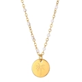 Macro view of gold palm tree engraved pendant with delicate white beaded chain necklace - Palm Tree