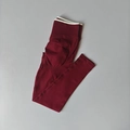 Detail of high waist seamless yoga leggings in wine red with ribbed waistband and contouring seam - Ancorra Red