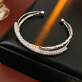 Close-up of silver double-layered open bangle with colorful zircon and faceted metal beads - Double Layer Pave Zirconia Beaded Style / Silver