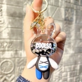 Detail of bunny acrylic liquid keychain with moving glitters and beads inside - Black