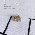 Detailed view of 10# gold elephant pendant with pavé cubic zirconia 12x11x1mm - 10# (Elephant)