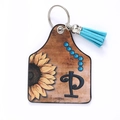 Brown faux leather sunflower tag keychain with letter P and blue tassel fringe detail - Letter P