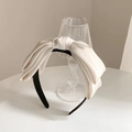Elegant oversized ivory satin bow headband with a black base for women's hair styling - Large Bow Headband / White