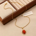 Detail of a gold snake chain necklace featuring an oval red gemstone and zircon frame - Gold Red Gemstone Geometric Necklace Style (6944)