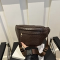 Deep brown woven leather chest bag with golden zipper and adjustable nylon strap - Brown