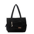 Large black corduroy tote bag with multiple pockets and a zipper pull detail - Black