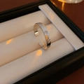 Detail of silver star-engraved open ring with zircon in a jewelry gift box - Silver