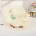 Detail showing lace trim, mesh bow, and 3D butterfly ornaments on kids' straw hat - Off-white Hat