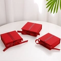 Elegant red jewelry gift box featuring flip-top design and decorative red Best Wishes ribbon - Red Specialty Paper