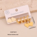 Golden stainless steel heart earring set featuring hoops and studs on display card - 9# Heart