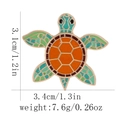 Detailed view of turtle enamel brooch with dimensions 3.1cm by 3.4cm on white background - Turtle Shape (C3060-4) / Orange Green