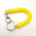 Yellow spiral spring keychain with durable plastic coil and metal lobster clasp for security - Yellow
