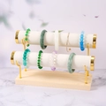 Two-tier gold metal and wood jewelry stand for bracelets with white faux leather rollers - 2-Tier Off-White