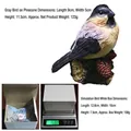 Realistic resin bird figurine on pine cone base with measurements and packaging details - Grey Bird on Pinecone