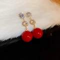 Macro shot of gold earrings with clear cubic zirconia flowers and red pearl drops - Silver Pin - Round Zircon Pearl Drop Earrings