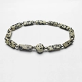 Detailed close-up of Dalmatian Jasper beads and silver spacers on a fashion stone bracelet - Dalmatian Jasper